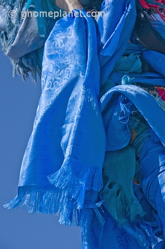Blue prayer scarves on an 'Ovoo', a Mongolian Shamanistic cairn for travellers.