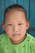 Mongolian girl in a green sweatshirt.