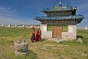Image of Young monks pass a blue-tiled temple at the Erdene Zuu Khiid (Hundred Treasures Monastery).