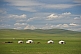 A camp of yurts on the Mongolian grassland.