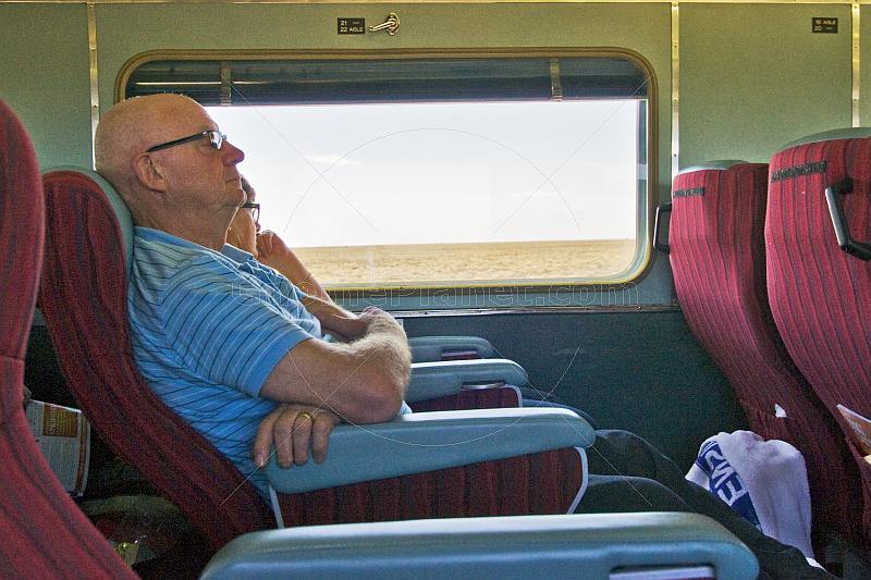 Passengers doze in Indian Pacific Day-Nighter seats crossing the Nullarbor Plain.