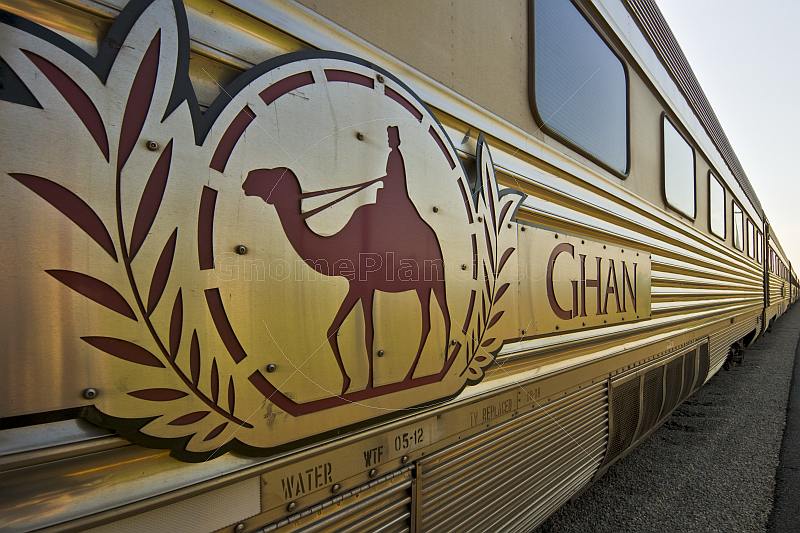 Ghan train camel logo and carriages at Alice Springs railway station.