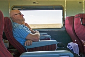 Passengers doze in Indian Pacific Day-Nighter seats crossing the Nullarbor Plain.