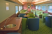 Facilities and seating in the Red Gum Lounge Car of the Ghan long distance train.