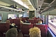 Image of Passengers and seating in Indian Pacific Red Class carriage.