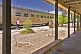 Indian Pacific passengers walk beside train carriages at Cook railroad station.
