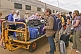 Passengers from Ghan train collect luggage at Alice Springs railroad station.