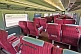 Image of Empty red and gray Day-Nighter seats in Ghan Red Class carriage.