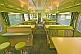 Tables and seating in the Matilda Cafe buffet car of the Ghan long distance train.