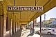 Image of Sign for Night Train bar on deserted downtown Argent Street.