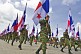 Soldiers of the Panamanian Defense Forces carry the national flag of Panama down the Avenida Balboa in the Flag Day Parade of 2014.