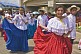 Young women wearing colorful Panamanian national costumes take part in the Flag Day Parade in Panama City.
