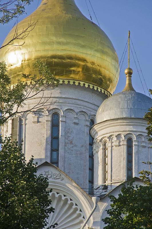 White towers and golden domes of the Annunciation Cathedral in the Kremlin.