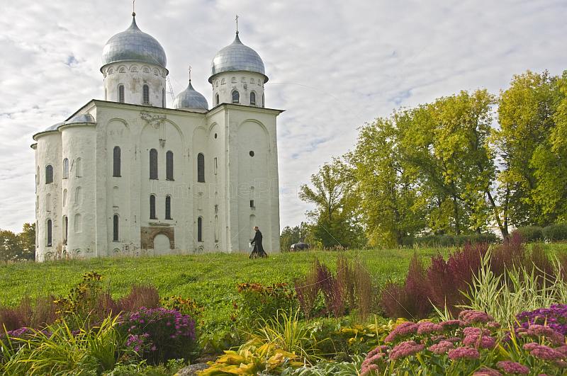 Cathedral of St George at the Yurev Monastery, set in a colourful garden of flowers.