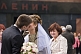 Image of A young Russian couple, just married, kiss in front of Lenin's Tomb, on Red Square.