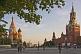 Image of Crowds wander past St. Basils Cathedral and across Red Square in the evening sunshine.
