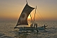 Traditional 'Oruwa' outrigger fishing boat at sunset