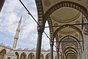 Exterior courtyard and minaret of Sultan Ahmet's blue mosque in Sultanahmet.