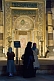 Image of Three female pilgrims view the mihrab of the Aya Sofya in Sultanahmet.