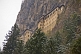 Image of The Sumela Monastery perches high on the side of a mountain.