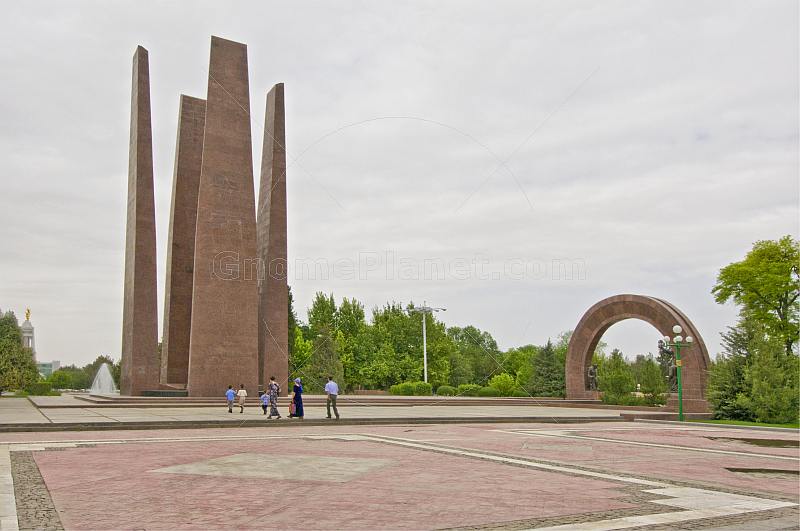 A Turkmen family makes a pilgrimage to the World War II memorial at Independence Square.