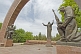 Statues of 2 kneeling soldiers guard the Soviet war memorial with its central statue of the Crying Mother.