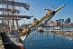 Image of Bows and rigging of the barque 'Picton Castle' against a background of Boston Harbor.
