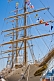 Colorful signal flags adorn the rigging of the tallship 'Libertad'.