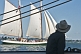 Image of Watching a sailing ship pass by from the barque 'Picton Castle'.