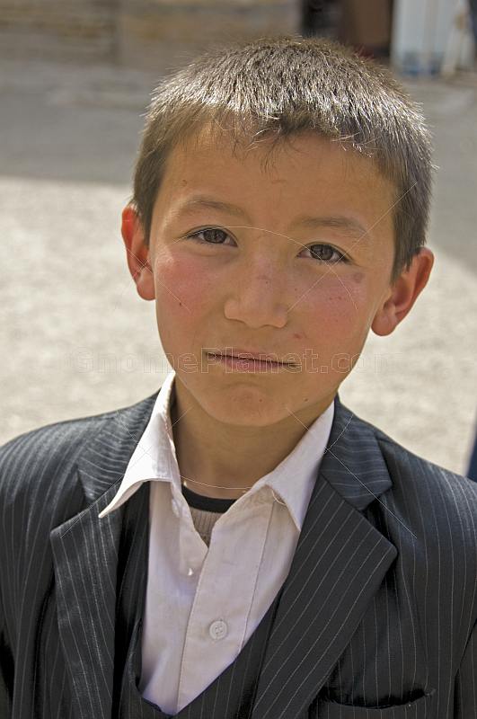 Young Uzbek boy in a suit.