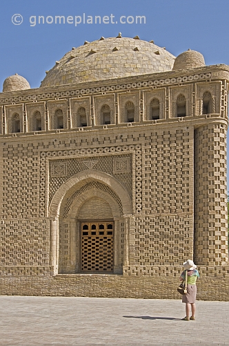 Tourist woman looks at the Mausoleum of Ismail Saman.