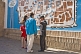 Image of Uzbek guide tells a tourist couple the history of this fabled Silk Road city.