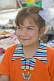 Image of Young Uzbek girl in orange teeshirt.