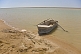 Image of A lone rowing boat awaits the fisherman on the Amudar Ja River, formerly famous as the mighty Oxus River.