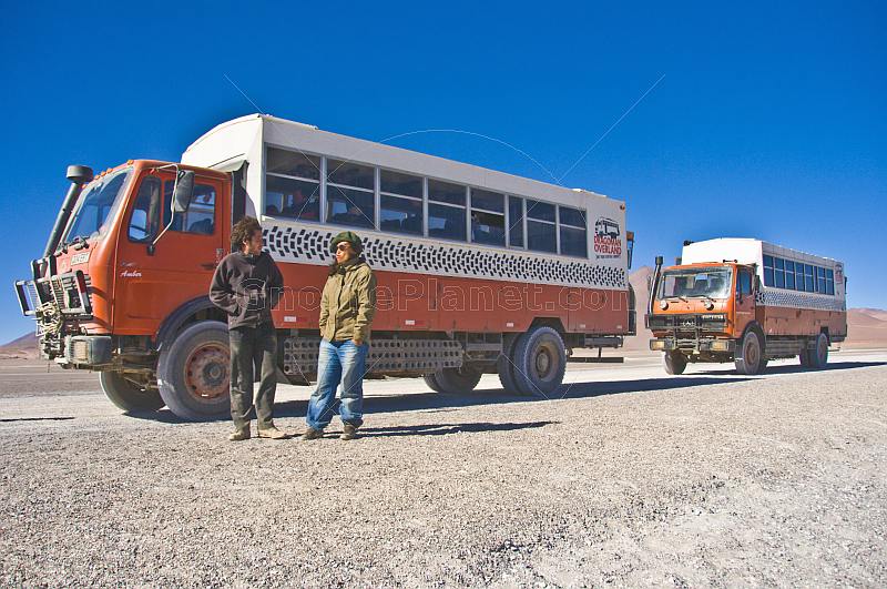 Two Dragoman Overland trucks and their drivers.