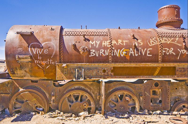 Graffiti on abandoned steam locomotive in the cemetery of steam engines.