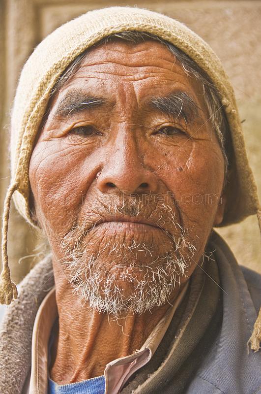Old Bolivian man with a knitted hat.