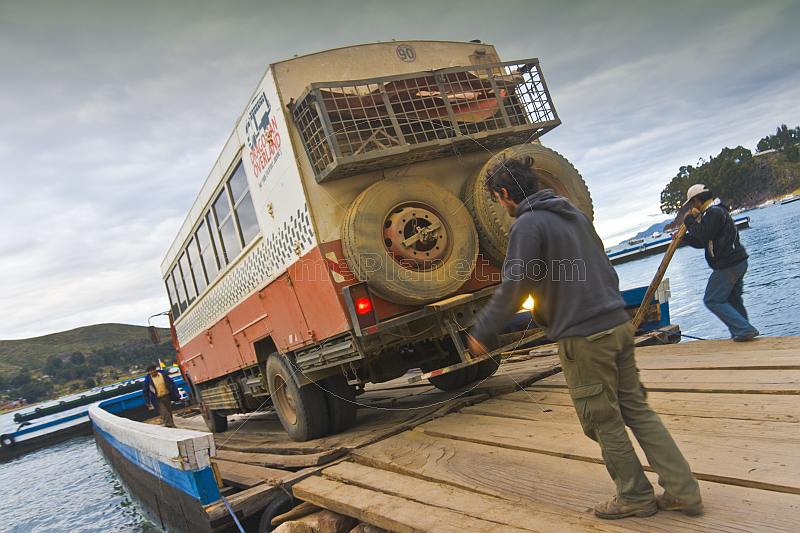 Loading a Dragoman Overland truck on to a barge to cross the Estrecho de Tiquina on Lake Titicaca.