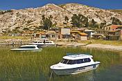 Boats moored in harbor on the Isla del Sol in Lake Titicaca.