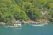 Boats at anchor in the waters of the Bahia Da Ilha Grande.