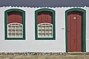 Colorful colonial house door and windows.