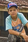 Young Brazillian cowboy in teeshirt and hat.