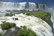 Waterfalls cascade into the Iguazu River.