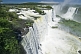 Image of Water with rainbow cascades into the river at the Iguazu Falls.