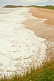 Image of Sunlit waves pound the deserted beaches at Sandbanks Provincial Park.