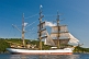 Crew climb the masts and unfurl sail as the barque 'Picton Castle' journeys towards the ocean.
