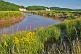 The Saint Croix River meanders past flower filled meadows and gypsum cliffs.
