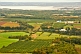 Forests and apple orchards contrast rolling farmland next to the Minas Basin.