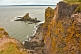 Steep lichen covered cliffs and rocky outcrops at the Cape Split Provincial Park Reserve.