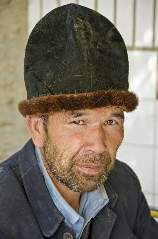 Local Kashgar man with traditional felt fur-rimmed hat known in Uighur as a doppa.